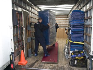 Employees at Willamette Valley Moving loading a truck for moving services in Oregon, Washington, and Idaho